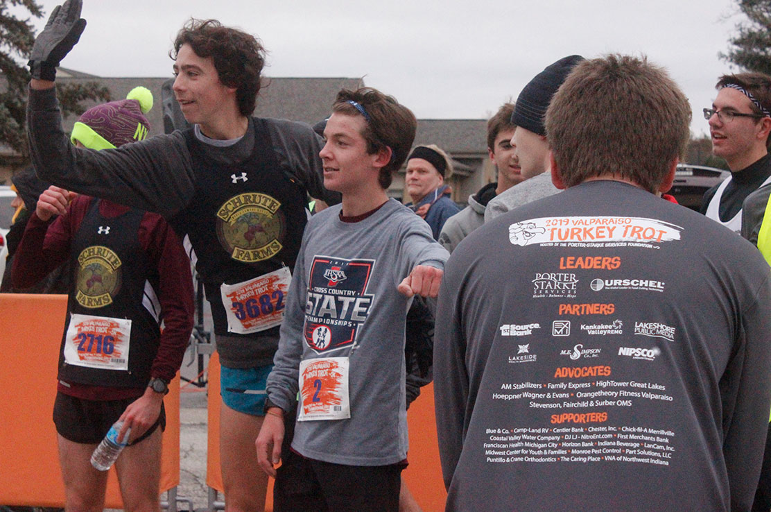 Runners celebrate at the finish of the Valparaiso Turkey Trot 5K