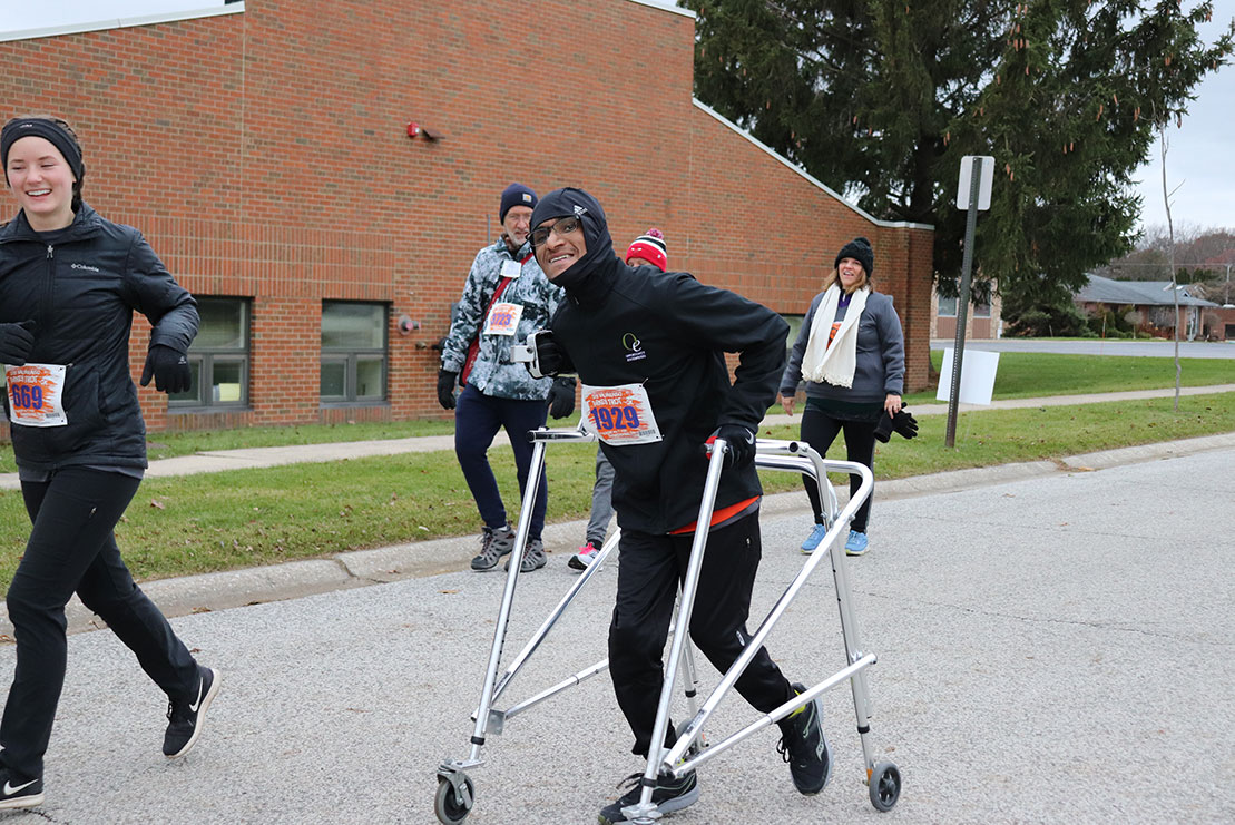 A race participant completes the paved 5K course.