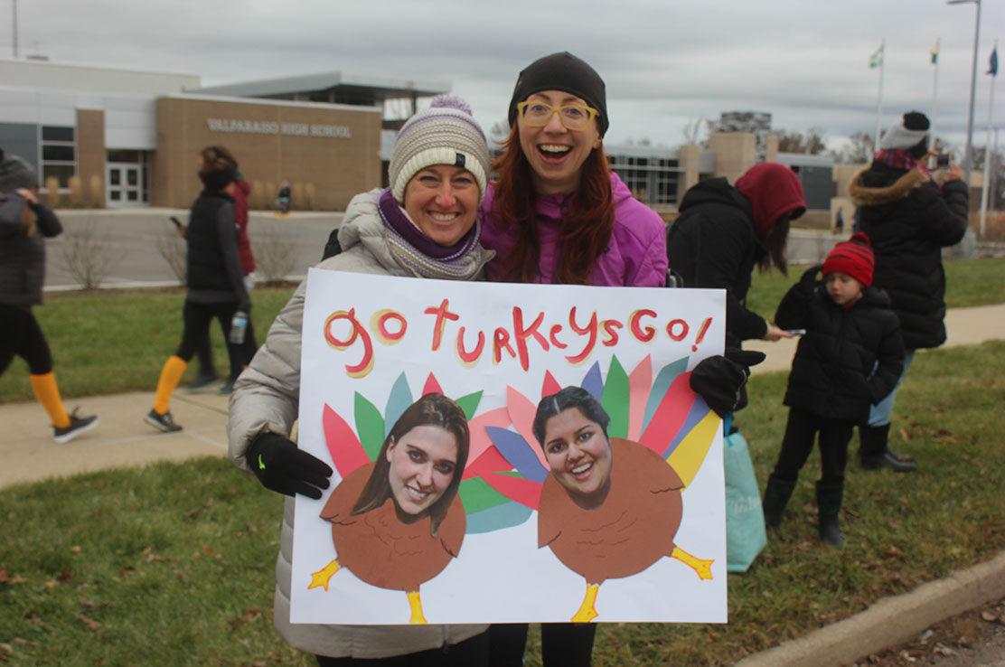 Spectators cheer for Valparaiso Turkey Trot runners and walkers.