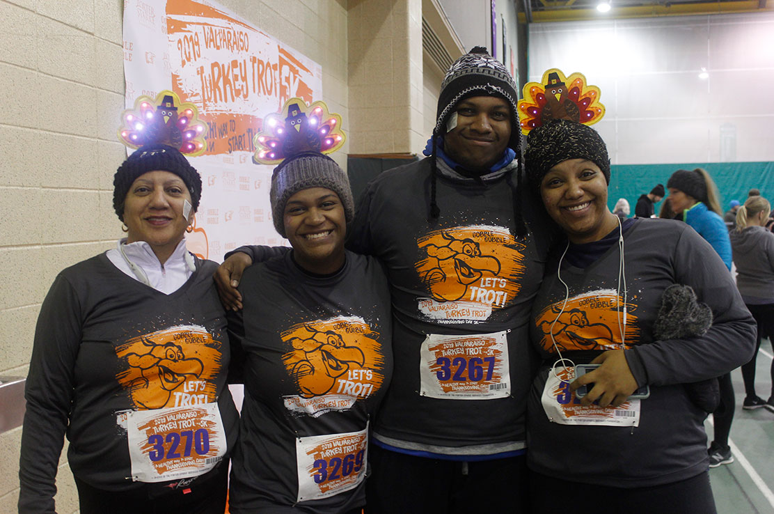 A family poses before the Valpo Turkey Trot.